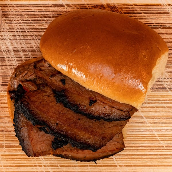 Hot Spot Barbecue's brisket sandwich, featuring smoky sliced brisket on a toasted bun.